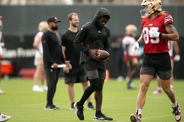 Still recovering from knee surgery, San Francisco 49ers wide receiver Brandon Aiyuk (left)  hangs out with teammate George Ki