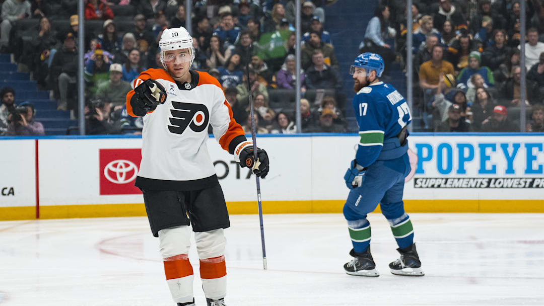 Dec 30, 2025; Vancouver, British Columbia, CAN; Vancouver Canucks defenseman Filip Hronek (17) reacts as Philadelphia Flyers forward Bobby Brink (10) celebrates his goal in the third period at Rogers Arena. Mandatory Credit: Bob Frid-Imagn Images