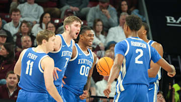 Jan 11, 2025; Starkville, Mississippi, USA; Kentucky Wildcats guard Travis Perry (11), forward Andrew Carr (7), and guard Otega Oweh (0) react after a basket against the Mississippi State Bulldogs during the second half  at Humphrey Coliseum. Mandatory Credit: Wesley Hale-Imagn Images