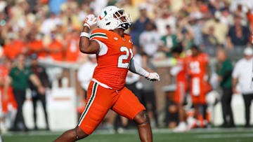 Nov 9, 2024; Atlanta, Georgia, USA; Miami Hurricanes linebacker Jaylin Alderman (21) reacts after a tackle against the Georgia Tech Yellow Jackets in the fourth quarter at Bobby Dodd Stadium at Hyundai Field. Mandatory Credit: Brett Davis-Imagn Images