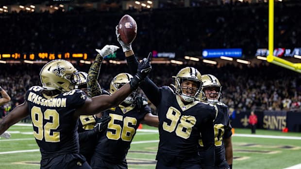 New Orleans Saints defensive end Payton Turner reacts to recovering a fumble against the Atlanta Falcons 