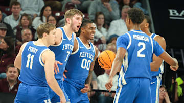 Jan 11, 2025; Starkville, Mississippi, USA; Kentucky Wildcats guard Travis Perry (11), forward Andrew Carr (7), and guard Otega Oweh (0) react after a basket against the Mississippi State Bulldogs during the second half  at Humphrey Coliseum. Mandatory Credit: Wesley Hale-Imagn Images