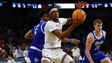 Mar 22, 2025; Wichita, KS, USA; Texas Tech Red Raiders forward JT Toppin (15) controls the ball against Drake Bulldogs guard Tavion Banks (6) during the first half at Intrust Bank Arena. Mandatory Credit: Nick Tre. Smith-Imagn Images