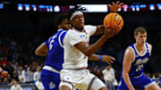 Mar 22, 2025; Wichita, KS, USA; Texas Tech Red Raiders forward JT Toppin (15) controls the ball against Drake Bulldogs guard Tavion Banks (6) during the first half at Intrust Bank Arena. Mandatory Credit: Nick Tre. Smith-Imagn Images