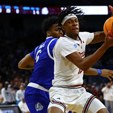 Mar 22, 2025; Wichita, KS, USA; Texas Tech Red Raiders forward JT Toppin (15) controls the ball against Drake Bulldogs guard Tavion Banks (6) during the first half at Intrust Bank Arena. Mandatory Credit: Nick Tre. Smith-Imagn Images