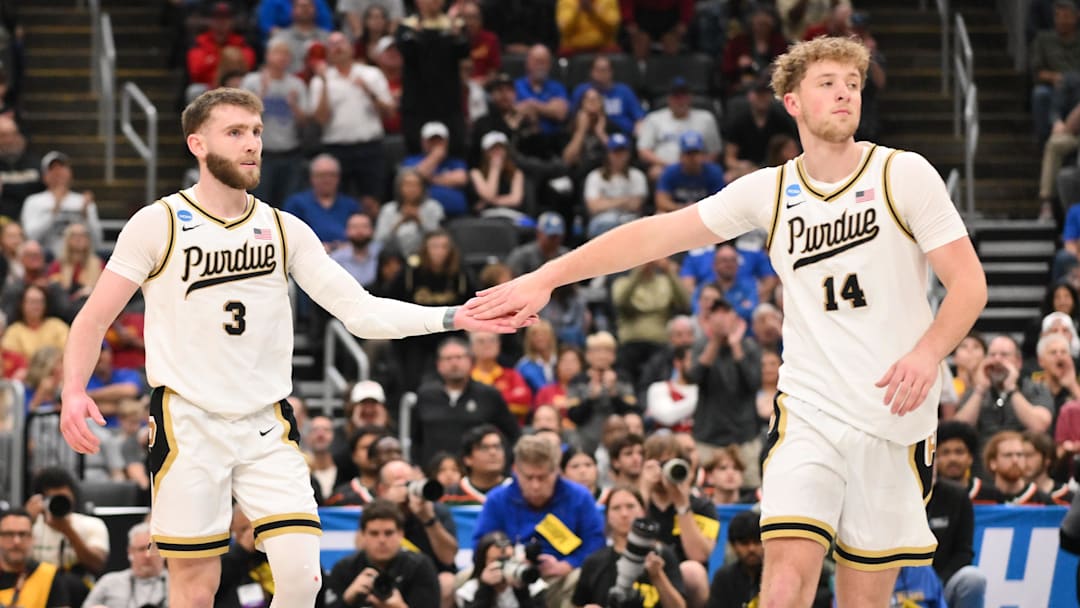 Purdue Boilermakers guard Braden Smith (3) celebrates with Purdue Boilermakers guard Jack Benter (14) after a play during the second half against the Miami Hurricanes during a second round game of the men's 2026 NCAA Tournament at Enterprise Center. Mandatory Credit: Jeff Curry-Imagn Images