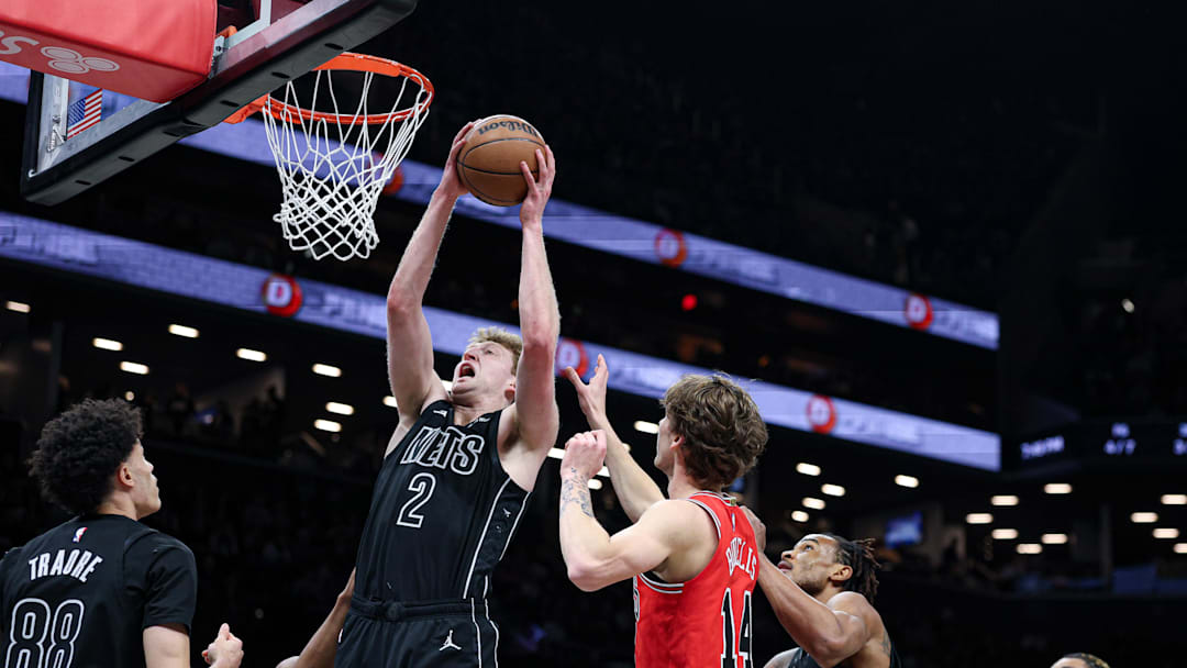 Feb 9, 2026; Brooklyn, New York, USA; Brooklyn Nets forward Danny Wolf (2) rebounds during the first quarter against Chicago Bulls forward Matas Buzelis (14) at Barclays Center. Mandatory Credit: Vincent Carchietta-Imagn Images