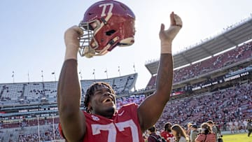 Nov 18, 2023; Tuscaloosa, Alabama, USA;  Alabama Crimson Tide offensive lineman Jaeden Roberts (77) celebrates after defeating the Chattanooga Mocs at Bryant-Denny Stadium. Alabama won 66-10. Mandatory Credit: Gary Cosby Jr.-USA TODAY Sports