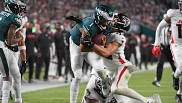 Sep 16, 2024; Philadelphia, Pennsylvania, USA; Philadelphia Eagles quarterback Jalen Hurts (1) is tackled by Atlanta Falcons linebacker Kaden Elliss (55) during the second quarter at Lincoln Financial Field. Mandatory Credit: Eric Hartline-Imagn Images