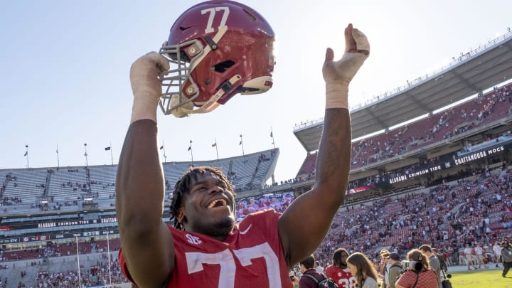 Nov 18, 2023; Tuscaloosa, Alabama, USA;  Alabama Crimson Tide offensive lineman Jaeden Roberts (77) celebrates after defeating the Chattanooga Mocs at Bryant-Denny Stadium. Alabama won 66-10. Mandatory Credit: Gary Cosby Jr.-USA TODAY Sports