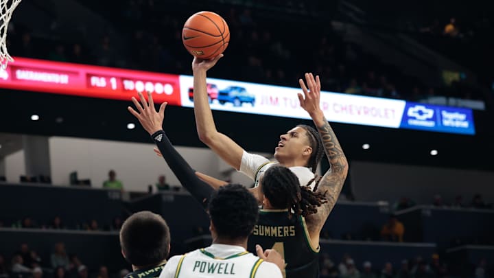 Dec 2, 2025; Waco, Texas, USA; Baylor Bears guard Cameron Carr (43) scores a basket over Sacramento State Hornets guard Jahni Summers (4) during the first half at Paul and Alejandra Foster Pavilion. Mandatory Credit: Chris Jones-Imagn Images Dec 2, 2025; Waco, Texas, USA; Baylor Bears guard Cameron Carr (43) scores a basket over Sacramento State Hornets guard Jahni Summers (4) during the first half at Paul and Alejandra Foster Pavilion. Mandatory Credit: Chris Jones-Imagn Images