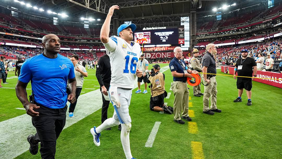 Detroit Lions quarterback Jared Goff (16) waves at fans to celebrate 45-21 win over Arizona Cardinals at State Farm Stadium in Glendale, Arizona on Sunday, Oct. 11, 2026.