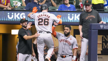 Aug 27, 2024; Milwaukee, Wisconsin, USA;  San Francisco Giants third baseman Matt Chapman (26) is greeted in the dugout after hitting a home run during the fourth inning against the Milwaukee Brewers at American Family Field. 