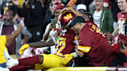 Washington Commanders running back Jacory Croskey-Merritt celebrates in the stands after touchdown against Cincinnati Bengals