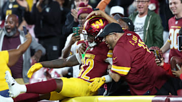 Washington Commanders running back Jacory Croskey-Merritt celebrates in the stands after touchdown against Cincinnati Bengals