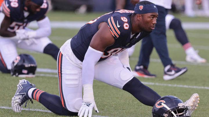 Dominique Robinson goes through stretching prior to Thursday's Hall of Fame Game. He did not show up on the stat sheet.