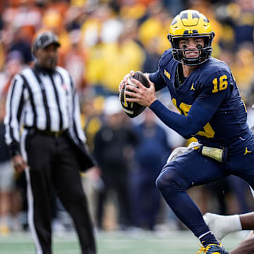 Michigan quarterback Davis Warren (16) keeps the ball for a run against Texas during the second half at Michigan Stadium in Ann Arbor on Saturday, September 7, 2024.