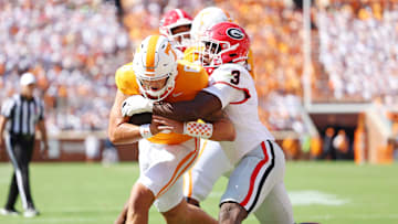 Tennessee Volunteers quarterback Joey Aguilar (6) run the ball as Georgia Bulldogs linebacker CJ Allen (3) 