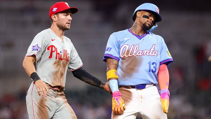 Philadelphia Phillies shortstop Trea Turner tags out Atlanta Braves right fielder Ronald Acuna Jr.