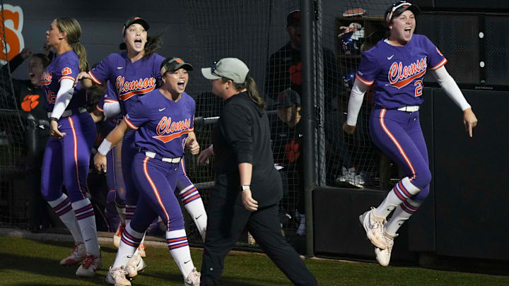 The Clemson softball team celebrates after scoring a run in extra innings during a NCAA softball game between Tennessee and Clemson at Sherri Parker Lee Stadium in Knoxville, Tenn., on April 22, 2025.