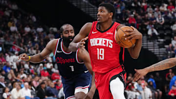 Houston Rockets guard Nate Williams (19) is defended by LA Clippers guard James Harden (1) and forward Derrick Jones Jr. (55) in the second half at the Intuit Dome.
