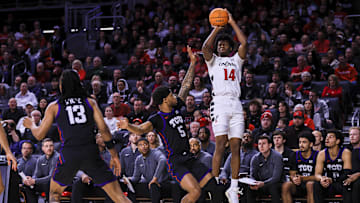 Feb 22, 2025; Cincinnati, Ohio, USA; Cincinnati Bearcats forward Tyler Betsey (14) shoots against TCU Horned Frogs forward Micah Robinson (5) in the first half at Fifth Third Arena. Mandatory Credit: Katie Stratman-Imagn Images