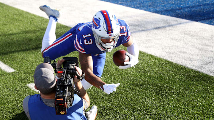 Bills receiver Gabe Davis barely avoids a photographer with NFL Films as he is forced out of bounds. Bills receiver Gabe Davis barely avoids a photographer with NFL Films as he is forced out of bounds.