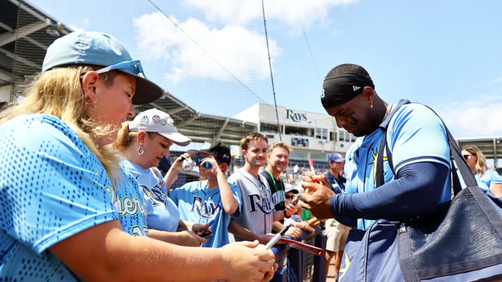 Mar 18, 2024; Port Charlotte, Florida, USA;  Tampa Bay Rays first baseman Yandy Diaz (2) signs autographs prior to the game against the Atlanta Braves at Charlotte Sports Park.