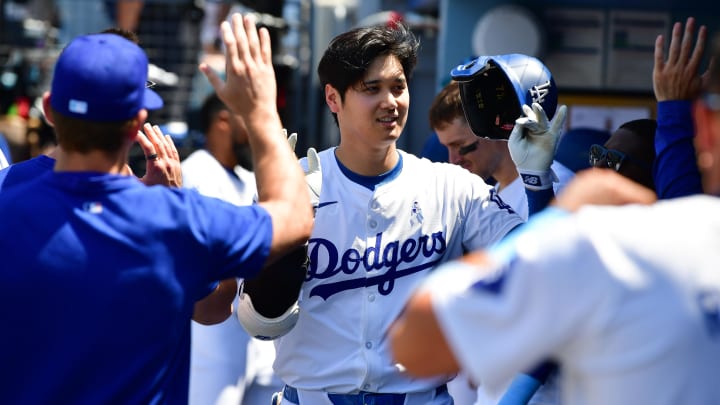 Los Angeles Dodgers designated hitter Shohei Ohtani (17) is greeted after hitting a solo home run against the Kansas City Royals during the sixth inning at Dodger Stadium. Mandatory Credit: Gary A. Vasquez-USA TODAY Sports