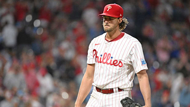 Philadelphia Phillies pitcher Aaron Nola (27) walks off the field after the sixth inning of a game against the New York Mets.