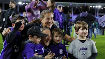 Nov 23, 2024; Kansas City, Missouri, USA; Orlando Pride forward Summer Yates (28) and defender Kerry Abello (25) celebrate after winning the 2024 NWSL Championship match at CPKC Stadium. Mandatory Credit: Kylie Graham-Imagn Images