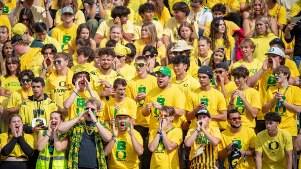 Oregon students cheer during warm ups as the Oregon Ducks host Colorado in the Pac-12 opener at Autzen Stadium.