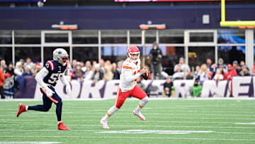 Dec 17, 2023; Foxborough, Massachusetts, USA; Kansas City Chiefs quarterback Patrick Mahomes (15) scrambles as New England Patriots linebacker Josh Uche (55) chases him during the second half at Gillette Stadium. Mandatory Credit: Eric Canha-Imagn Images