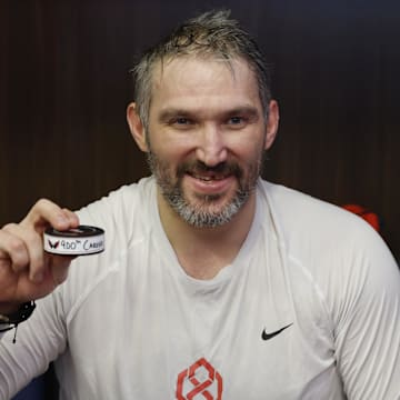 Blues goalie Jordan Binnington tried to sneak away with this historic puck. 