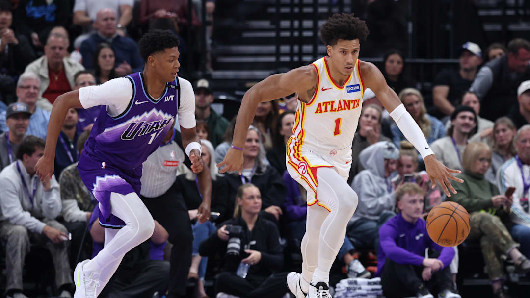 Nov 13, 2025; Salt Lake City, Utah, USA; Atlanta Hawks forward Jalen Johnson (1) dribbles against Utah Jazz guard Ace Bailey (19) during the second quarter at Delta Center. Mandatory Credit: Rob Gray-Imagn Images