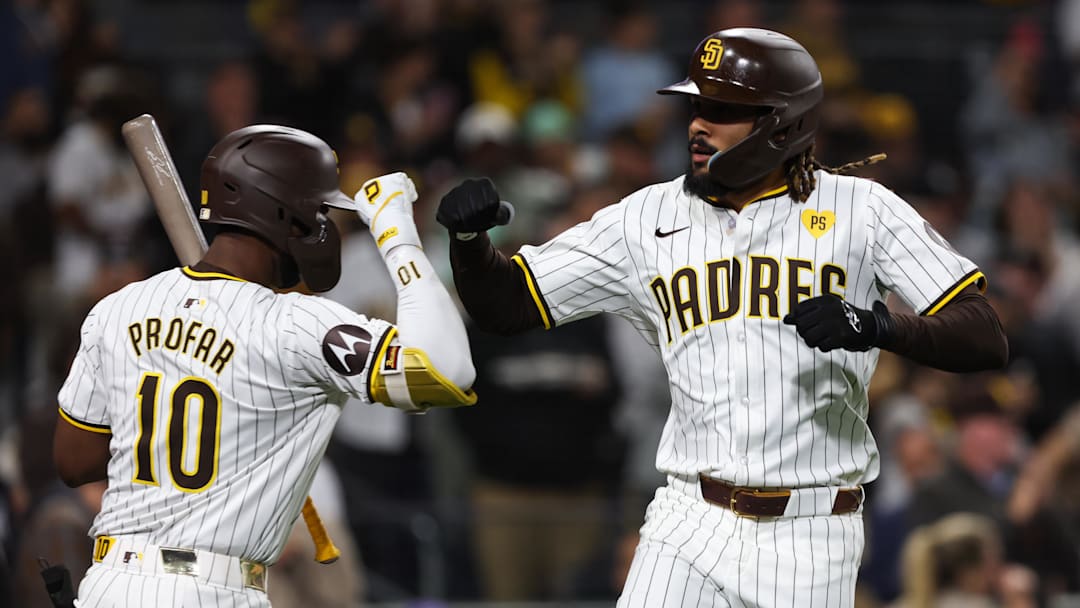 May 25, 2024; San Diego, California, USA; San Diego Padres right fielder Fernando Tatis Jr. (23) celebrates with left fielder Jurickson Profar (10) after hitting a solo home run in the eighth inning against the New York Yankees at Petco Park. Mandatory Credit: Chadd Cady-USA TODAY Sports