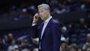Nov 28, 2025; Charlottesville, Virginia, USA; Virginia Cavaliers head coach Ryan Odom reacts after a call against the Queens University of Charlotte Royals during the first half at John Paul Jones Arena. Mandatory Credit: Amber Searls-Imagn Images
