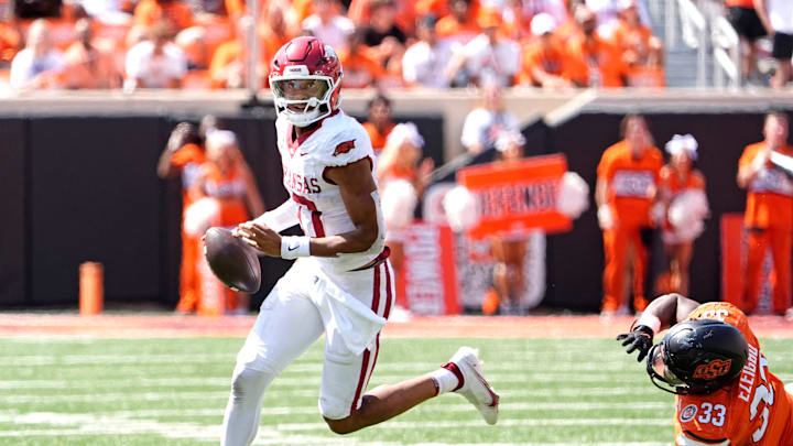 Arkansas' Taylen Green (10) gets by Oklahoma State's Obi Ezeigbo (33)d in the first over time of the college football game between the Oklahoma State Cowboys and the Arkansas Razorbacks at Boone Pickens Stadium in Stillwater, Okla.,, Saturday, Sept., 7, 2024.