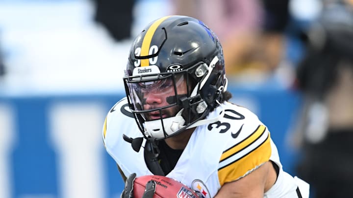 Jan 15, 2024; Orchard Park, New York, USA; Pittsburgh Steelers running back Jaylen Warren (30) warms up before the game against the Buffalo Bills in a 2024 AFC wild card game at Highmark Stadium. Mandatory Credit: Mark Konezny-Imagn Images