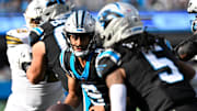 Nov 9, 2025; Charlotte, North Carolina, USA; Carolina Panthers quarterback Bryce Young (9) fakes a handoff to running back Rico Dowdle (5) in the third quarter at Bank of America Stadium. Mandatory Credit: Bob Donnan-Imagn Images