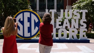 People take photos of an SEC sign outside Gaylord Family-Oklahoma Memorial Stadium in Norman, Okla., during a celebration for OU joining the Southeastern Conference in Norman, Okla., Monday, July 1, 2024.
