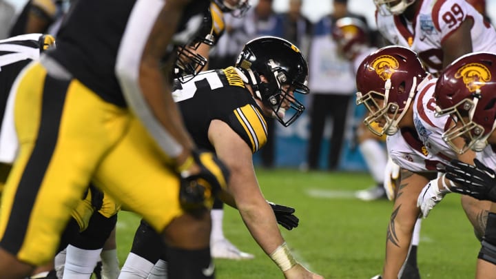 Dec 27, 2019; San Diego, California, USA; General overall view of the line of scrimmage as Iowa Hawkeyes offensive lineman Tyler Linderbaum (65) snaps the ball against the Southern California Trojans during the Holiday Bowl at SDCCU Stadium. Iowa defeated USC 49-24.  Mandatory Credit: Kirby Lee-USA TODAY Sports