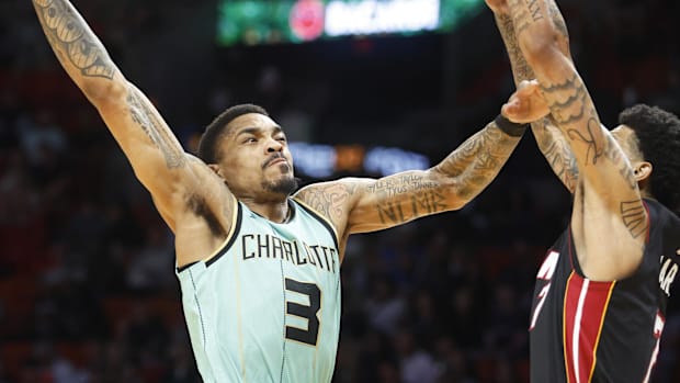 Charlotte Hornets Guard Daquan Jeffries (3) is defended by Miami Heat Center Kel'el Ware