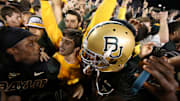 Nov 17, 2012; Waco, TX, USA; Baylor Bears players celebrate with fans after the game against the Kansas State Wildcats at Floyd Casey Stadium. The Bears beat the Wildcats 52-24. Mandatory Credit: Matthew Emmons-Imagn Images