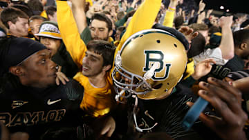 Nov 17, 2012; Waco, TX, USA; Baylor Bears players celebrate with fans after the game against the Kansas State Wildcats at Floyd Casey Stadium. The Bears beat the Wildcats 52-24. Mandatory Credit: Matthew Emmons-Imagn Images