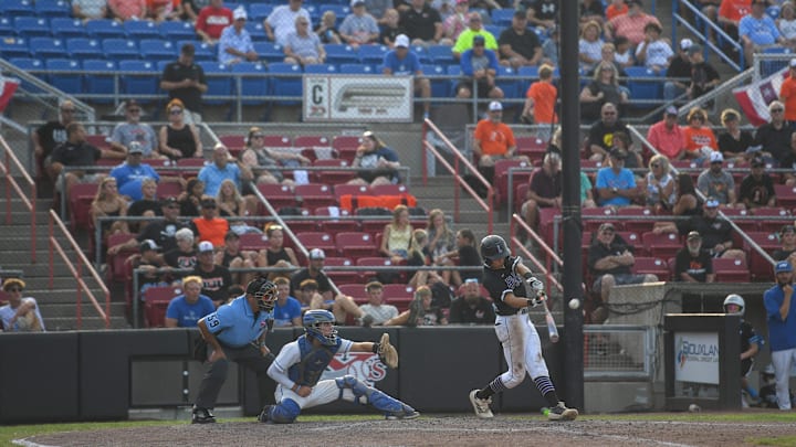 Iowa City Liberty sophomore Pryor Reiners (31) hits the ball during the Iowa High School baseball tournament on Tuesday, July 22, 2025, at Lewis and Clark Park in Sioux City, Iowa.