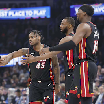 Feb 12, 2025; Oklahoma City, Oklahoma, USA; Miami Heat guard Tyler Herro (14), guard Davion Mitchell (45), forward Andrew Wiggins (22) and center Bam Adebayo (13) high five after a play against the Oklahoma City Thunder during the first quarter at Paycom Center. Mandatory Credit: Alonzo Adams-Imagn Images