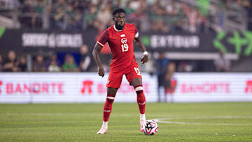 Sep 10, 2024; Arlington, TX, USA; Canada defender Alphonso Davies (19) dribbles the ball against Mexico during the first half at AT&T Stadium. Mandatory Credit: Brett Patzke-Imagn Images