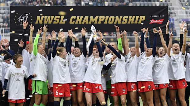 The Washington Spirit celebrate after defeating the Chicago Red Stars in the '21 NWSL Championship match at Lynn Family Stad.