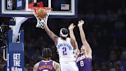 Feb 5, 2025; Oklahoma City, Oklahoma, USA;Oklahoma City Thunder guard Shai Gilgeous-Alexander (2) shoots as Phoenix Suns guard Grayson Allen (8) defends during the second half of a game at Paycom Center. Mandatory Credit: Alonzo Adams-Imagn Images